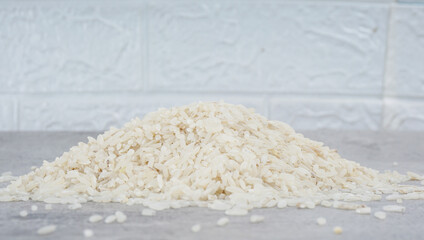 Fototapeta na wymiar White rice natural on cement background. selective focus