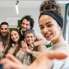 woman caucasian female in front of group of people happy smile at work