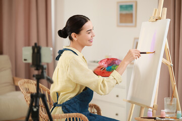 Teacher conducting online painting lesson at home. Time for hobby