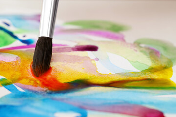 Obraz premium Painting with bright watercolor on paper, closeup. Space for text