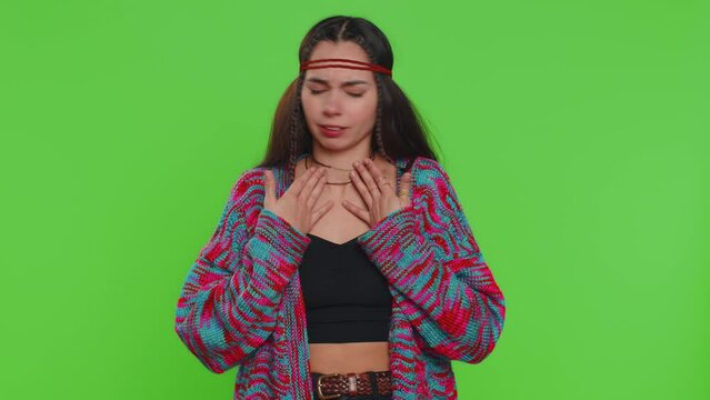 Unhealthy young woman coughing covering mouth with hand, feeling sick, allergy or viral infection symptoms, fever pain virus. Pretty hippie girl isolated alone on chroma key background, green screen
