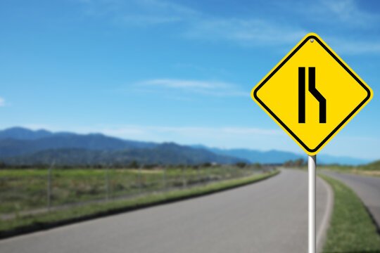 Road Narrows On Right road sign on highway, space for text