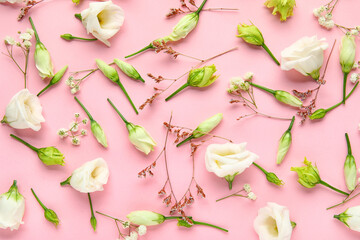 Composition with different flowers on pink background