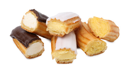 Many cut delicious eclairs isolated on white