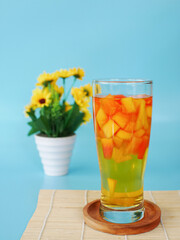 bul bul ice or fruit ice drinks filled with pieces of pineapple and papaya. Indonesian fruit ice
