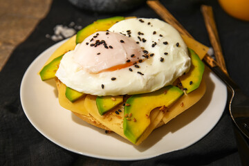 Plate with tasty egg Benedict on table, closeup
