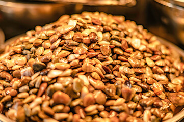 Pickled clams in fish sauce put in a container for sale at Nong Mon Market, Bang Saen, Thailand.