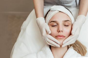 Fototapeta na wymiar Close-up Of Woman Getting Peeling Treatment At Cosmetic Beauty salon