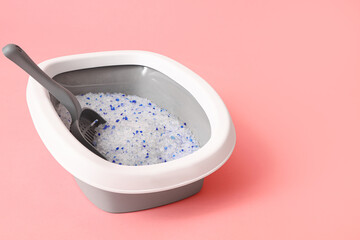 Litter box for cat on pink background