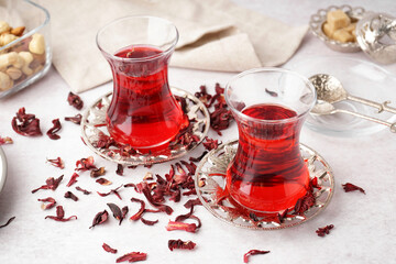Glasses of Turkish hibiscus tea on white table