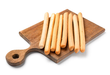 Wooden board with tasty Italian Grissini on white background