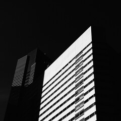 Low key dark shot of office building in Tokyo, Japan