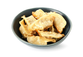 Bowl with tasty Chinese jiaozi and sesame on white background