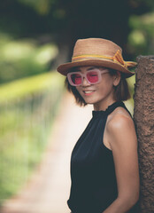 beautiful asian woman wearing straw hat toothy smiling with happiness face
