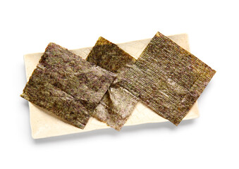 Plate with natural nori sheets isolated on white background