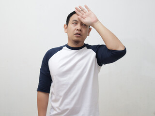 Young Asian man gets cold and fever, feeling headache pain deezy and shiver, against grey
