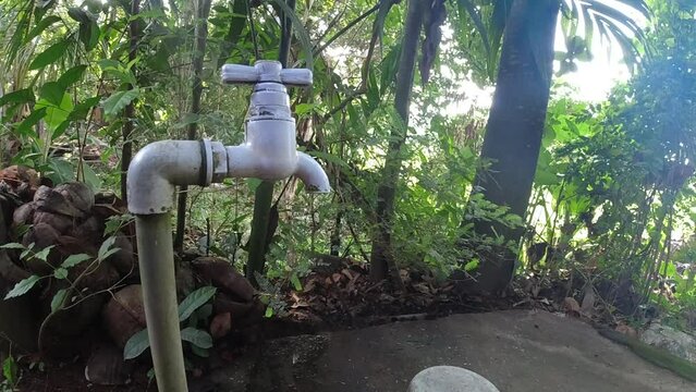tap in the garden Slow motion water drop