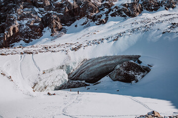 Beautiful ice cave in glacier. Winter mountain landscape.