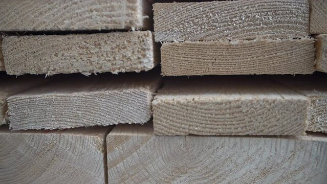 panning of closeup of stacked lumber at the store
