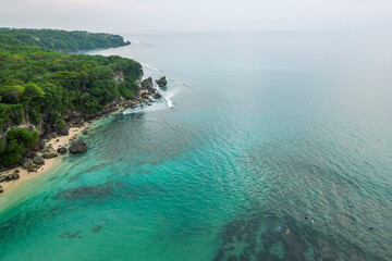Aerial view of the seashore of Padang Padang Beach on Bali Island.