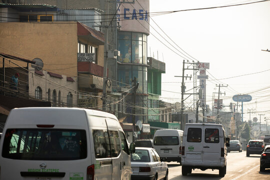 Ecatepec de Morelos, Mexico - November 19, 2022: Morning light shines on a busy downtown street of Ecatepec de Morelos.