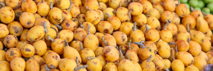 Fruits and vegetables in market closeup. Mature appetizing pears on counter