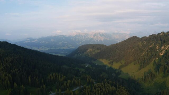 Aerial view overlooking the Riedbergpass road in Allgau, Germany - reverse, drone shot