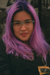 portrait of glasses Asian female with purple hair color