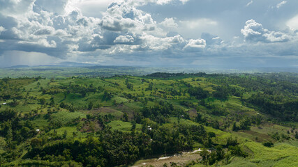 Farmland and mountains with green forest. Negros, Philippines.