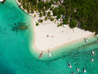 Aerial drone of tropical island and a sandy beach in the sea. Virgin Island, Philippines.