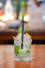 Mojito cocktail set on a bar table, refreshing alcoholic beverage originated in Cuba, typically made with rum, lime, mint, and sugarcane, summer drink with a perfect balance of sweetness and tartness