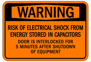 Door safety sign and labels risk of electrical shock from energy stored in capacitor. Door is interlocked for 5 minutes after shutdown of equipment