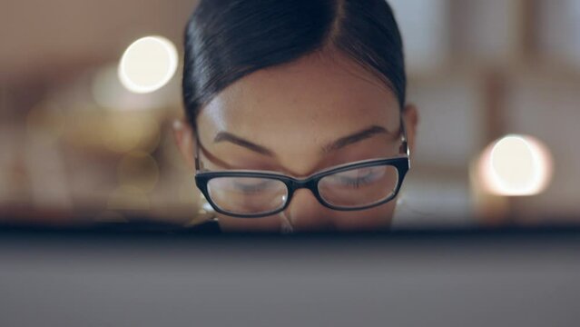 Indian woman, face and working night at office, lawyer planning and prepare for case with research at computer. Deadline, overtime and work late at law firm, female in glasses and concentration