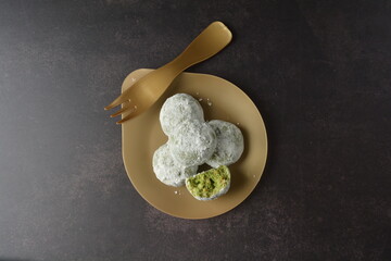 homemade Japanese western asian cookies with peanut, matcha, earl grey tea, almond green tea and icing sugar in round shape on black and gold luxury background handmade fresh bakery pastry halal menu