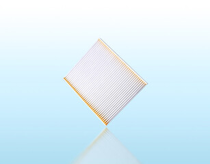 Cabin air filter isolated for car on blue background with reflection, clipping path included.