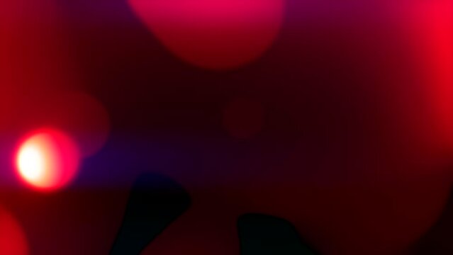 juicy red and orange smooth bland shapes on dark background - loop video