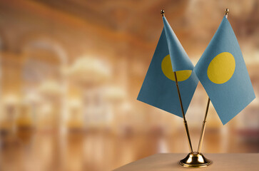 A small Palau flag on an abstract blurry background