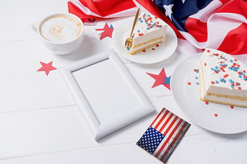 Obraz premium Sweet cake with usa flag colored sprinkles and stars and blank frame for mockup
