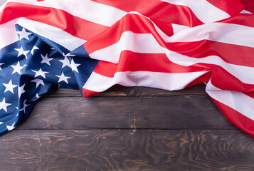 Closeup of American flag on dark wooden background