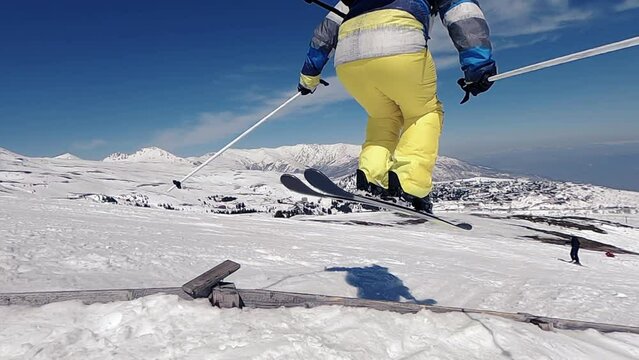 Slow motion of skiing. Jumping skier. Extreme winter sports