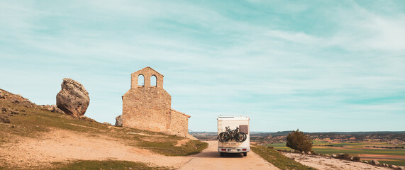 Naklejka premium Motorhome in country road in Spain, Castile and Leon, Soria province