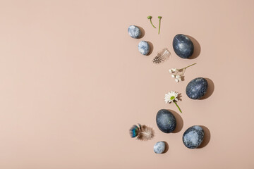 Composition for Easter on a light background. Blue eggs and white flowers. Spring concept