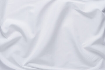 White fabric. luxurious white fabric texture background. Creases of satin, silk and cotton.