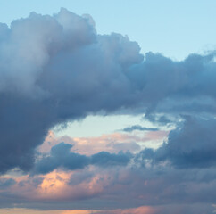 Rain clouds at sunset as background