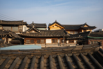 Fototapeta na wymiar Bukchon Hanok Village and traditional roofs in Seoul during winter afternoon at Jongno-gu , Seoul South Korea : 7 February 2023
