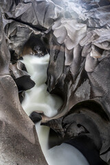 River cutting through smooth rock formation in Brazil