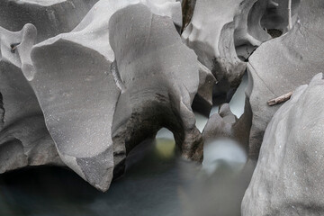 Smooth rock formations in a river in long exposure