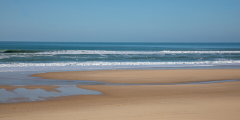 Fototapeta na wymiar natural beach sandy coast sea low tide on sand ocean