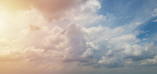 Beautiful white clouds contrasting with the sunlight and blue sky, Sky background.