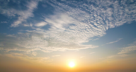 Beautiful sun shines beautifully upon the Cirrocumulus  clouds in the evening, Sky background.